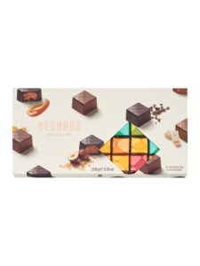 Assortment of milk and dark chocolate pralines with classic fillings such as gianduja, praliné and caramel from Isigny.