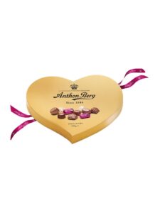 Chocolate pralines in heart shaped gold box