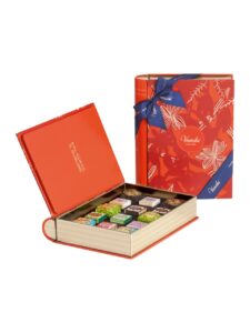 Venchi assorted chocolates in a book-shaped metal tin