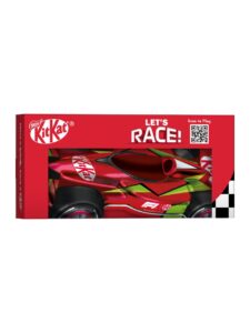 KitKat bars and chocolate race cars in a tin shaped like a Formula 1 car